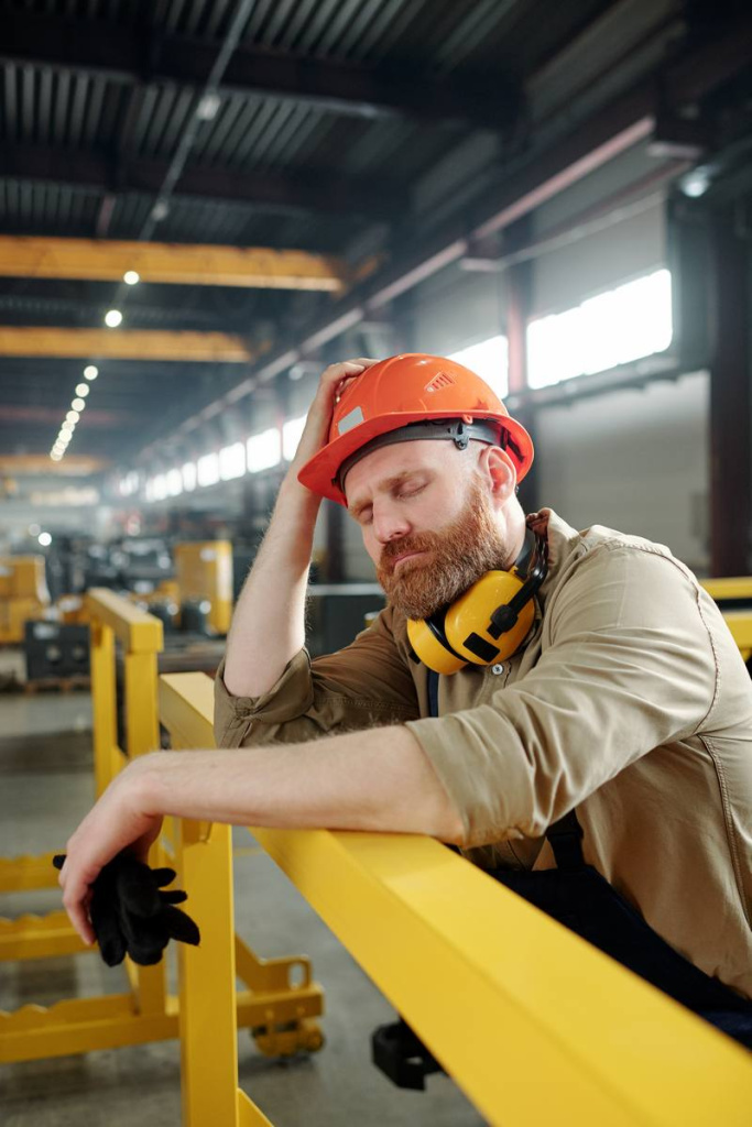 tired-sick-engineer-workwear-hardhat-leaning-by-bar-while-having-break-middle-working-day-factory.jpg