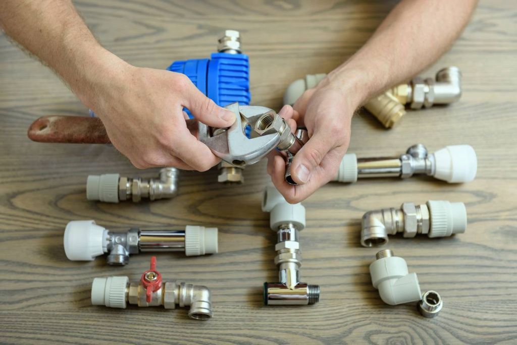 worker-is-connecting-elements-plumbing_tn.jpg